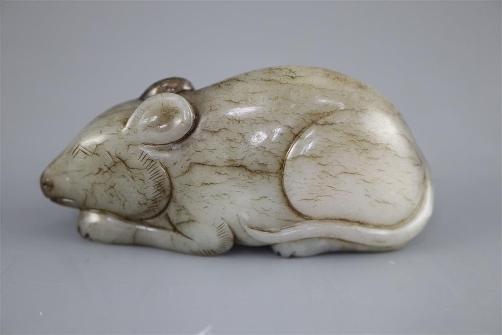 A Chinese grey and black jade figure of a recumbent mouse, 7.7cm long